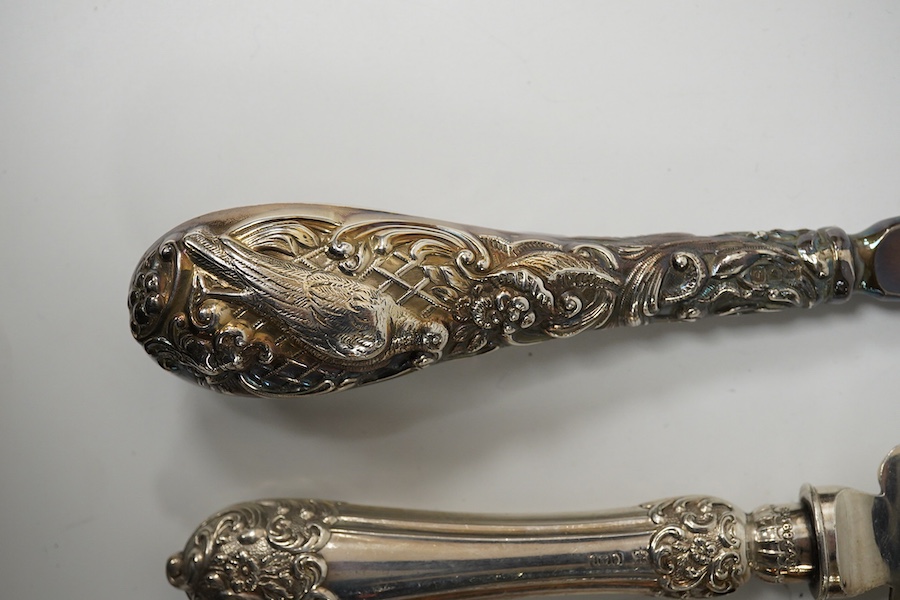 An Edwardian silver cake knife with engraved blade and decorative handle, James Deakin & Sons, Sheffield, 1901, together with a late Victorian silver handled button hook and silver handled shoe horn. Condition - poor to